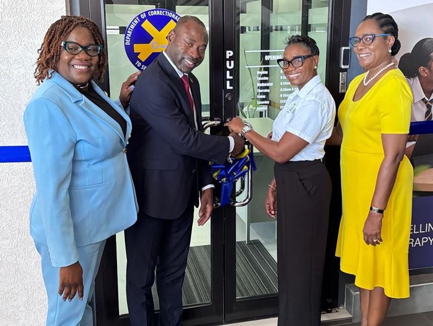 Minister of State in the Ministry of National Security and Peace, the Hon. Juliet Cuthbert-Flynn (2nd right) and the Commissioner of the Department of Correctional Services (DCS), Brigadier (Ret’d) Radgh Mason (2nd left), are joined by Permanent Secretary, Ambassador Alison Stone Roofe (right) and Principal Probation Aftercare Officer, Mrs. Kerry-Ann Davis (left), in cutting of the ribbon to officially open the new Probation Office in Portmore, St. Catherine on Wednesday (July 8).