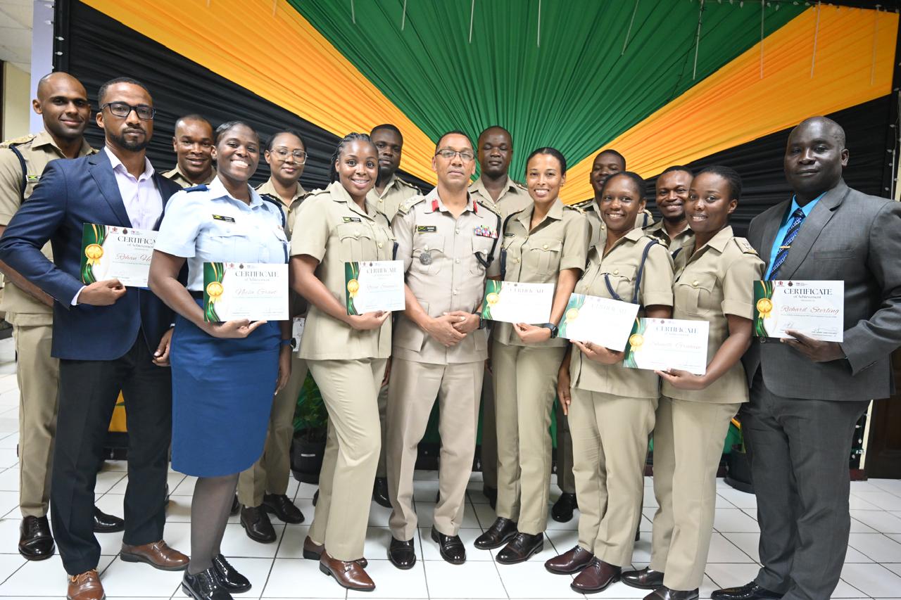 Chair of the Ministry's Capital Monitoring Committee, Mrs. Karen Clarke-Davis (left), presents Superintendent Vidaya Harrigan of the Royal Anguilla Police Force, with a certificate of excellence on September 3 at the Project Management Graduation Ceremony.