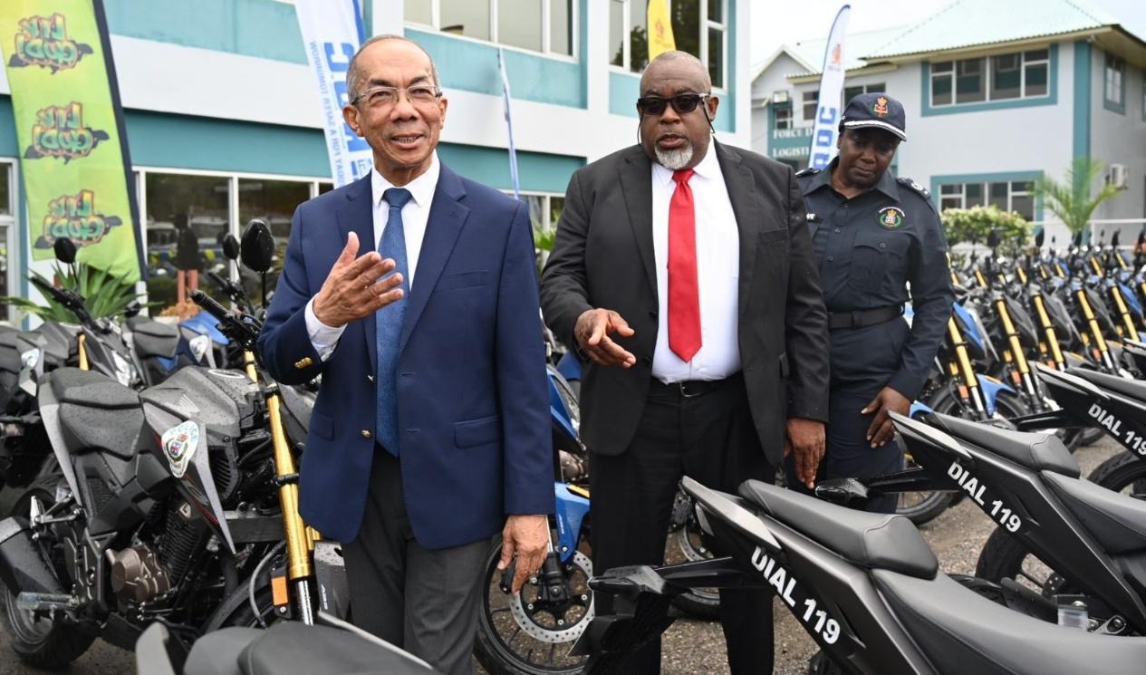 Deputy Prime Minister and Minister of National Security and Peace, the Hon. Dr. Horace Chang (left), inspects newly added police fleet vehicles, including 70 motorbikes, during a handover ceremony at the Office of the Commissioner of Police in Kingston on Thursday, April 9, 2026. He is joined by Deputy Commissioner of Police responsible for the Crime and Security Portfolio, Richard Stewart, and Assistant Commissioner of Police, Jacqueline Green Scafe.
