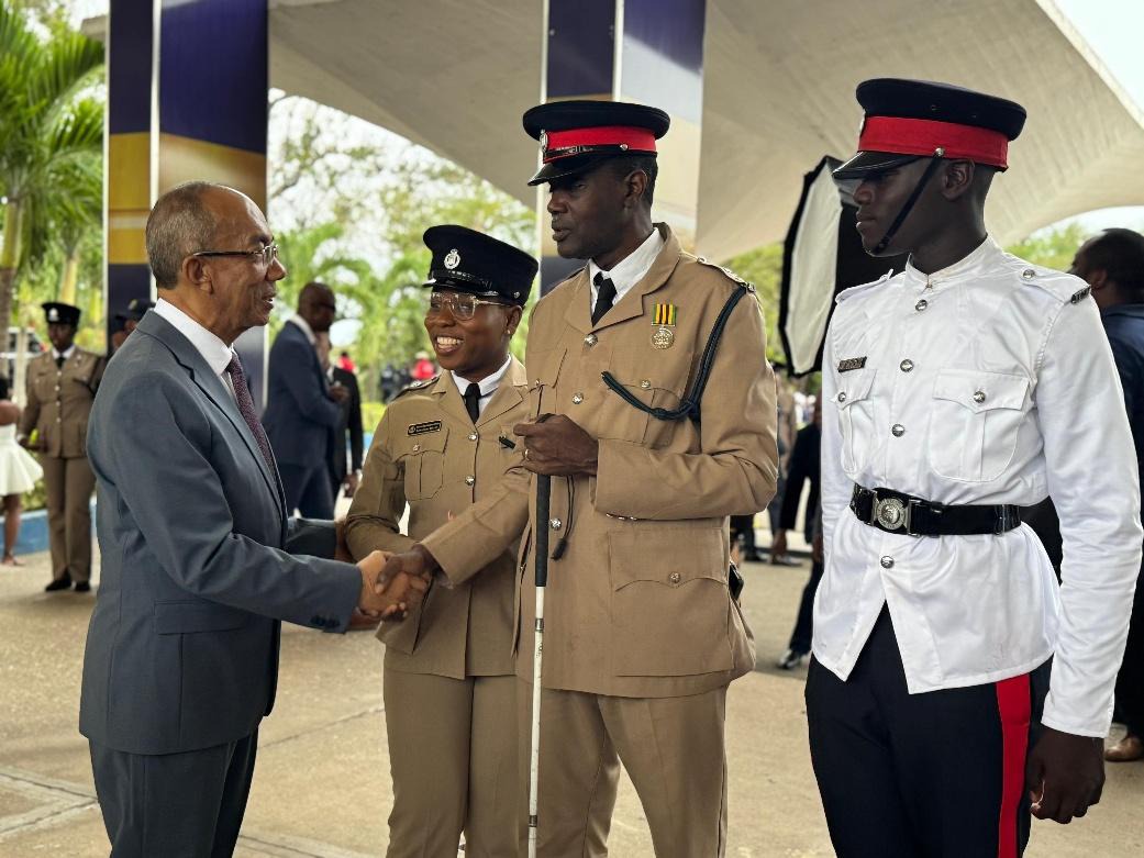 Deputy Prime Minister and Minister of National Security and Peace, the Hon. Dr. Horace Chang (left) greets Detective Inspector Rohan Brown (2nd right) and his son, Constable Raheem Brown (right) who was a member of the freshly minted batch of officers who joined the ranks of the Jamaica Constabulary Force on Wednesday (March 25). Also photographed is Assistant Superintendent of Police Samantha Bryan (2nd left) who beamed with pride. The profound moment was captured at the Jamaica Constabulary Force Passing 